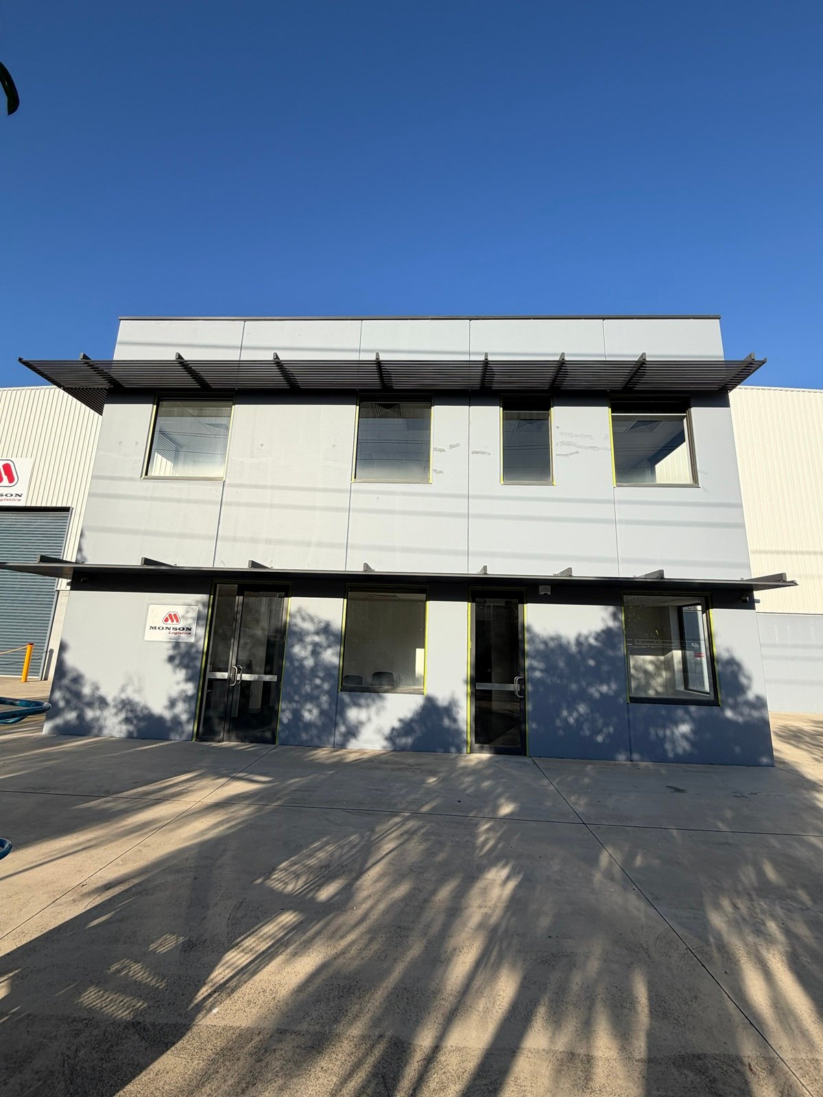 Two-storey Monson Logistics office facade after commercial repaint