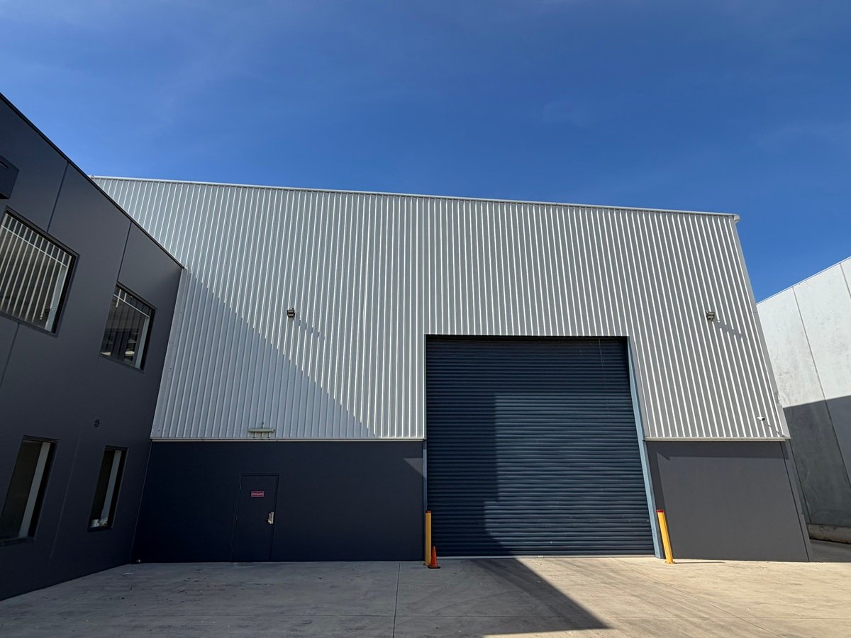 Freshly painted two-storey commercial facade for Monson Logistics, Melbourne, completed by Renovaco Group